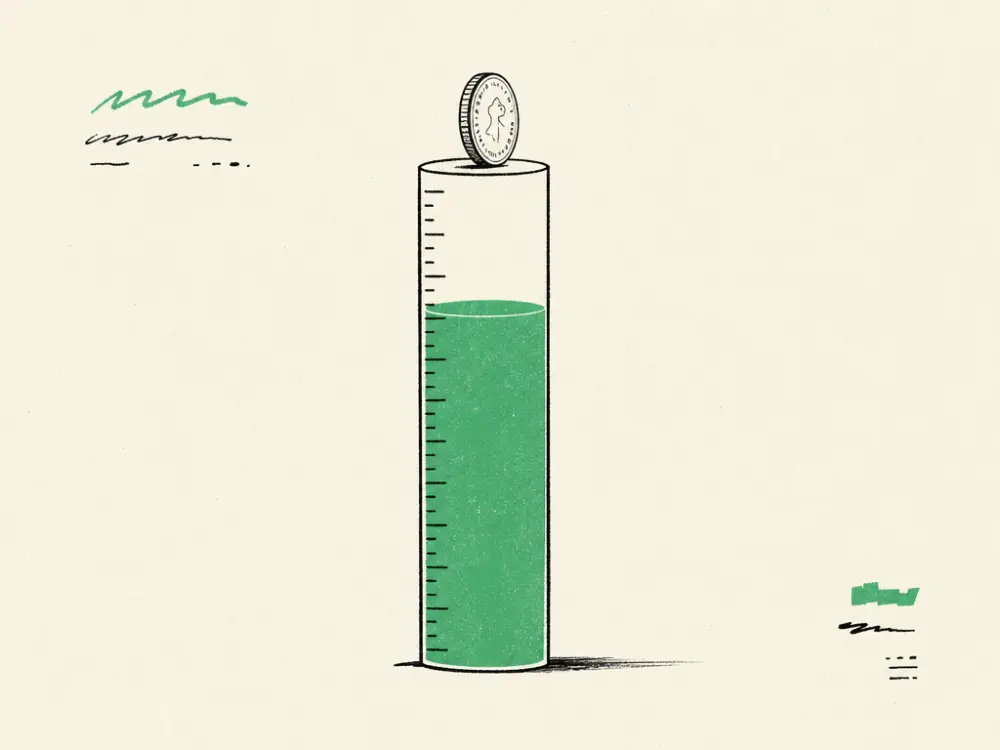 A vertical ink gauge with graduated notches filled two-thirds brand green, a coin on the rim