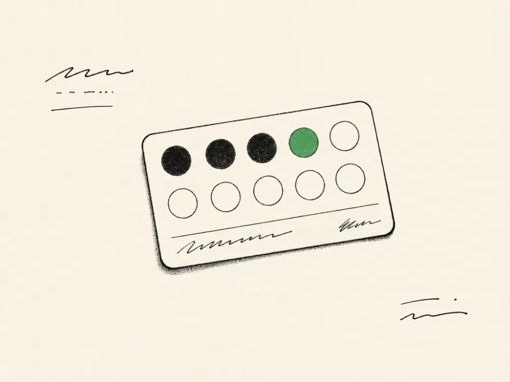 An ink loyalty card with a grid of stamp circles, one filled brand green