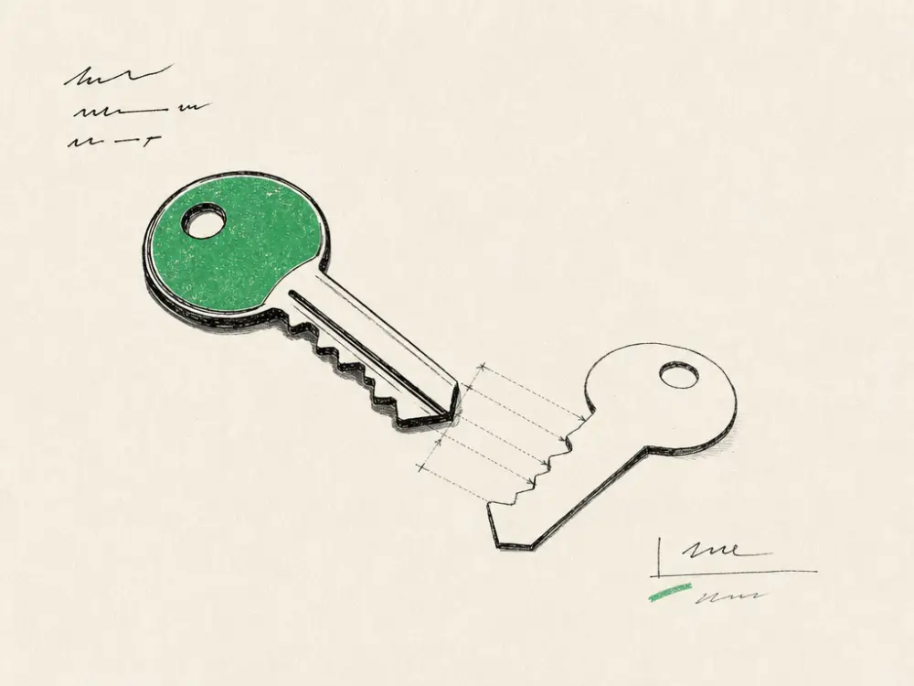 An ink key beside a duplicate cut from the same blank, one bow brand green