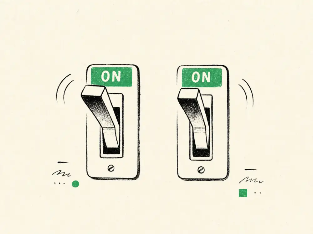 Two ink levers flipped up into a brand-green on-zone, side by side