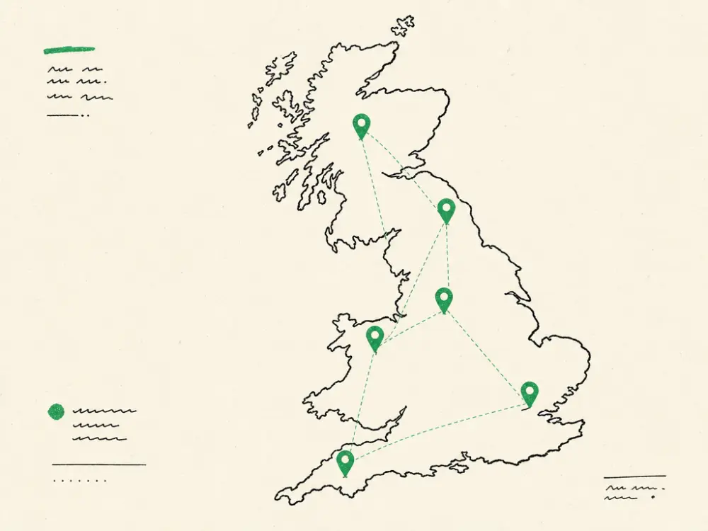 An ink outline map of Great Britain with several brand-green location pins across it